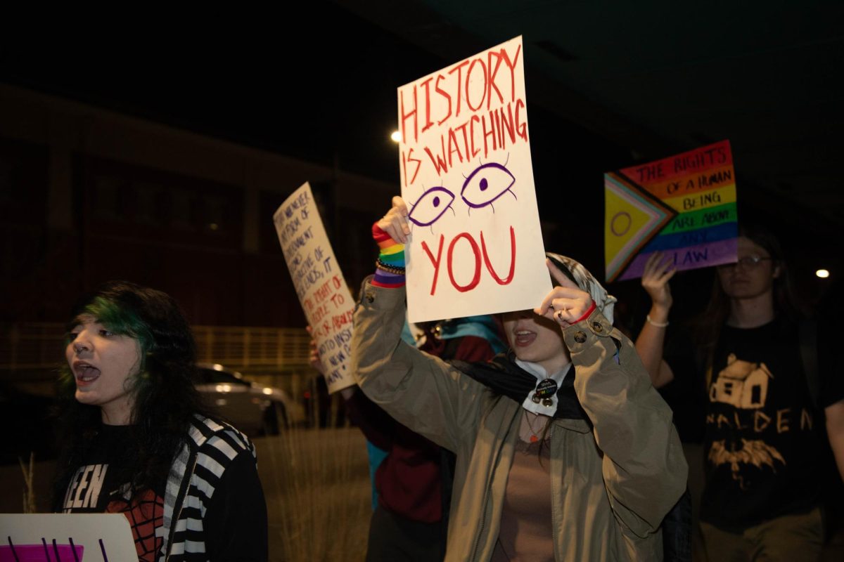 Attendees of the Power in Unity event march from the Carbondale Civic Center down to the Gaia House Interfaith Center Nov. 8, 2024 at the Carbondale Civic Center in Carbondale, Illinois.