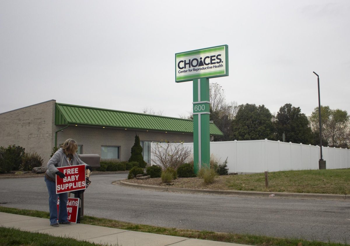 Darlene Blumenstock walks along the sidewalk outside of CHOICES Center for Reproductive Health Nov. 13, 2024, in Carbondale, Illinois. Blumenstock said she was praying for a driver that had yet to exit their car in the parking lot. 
