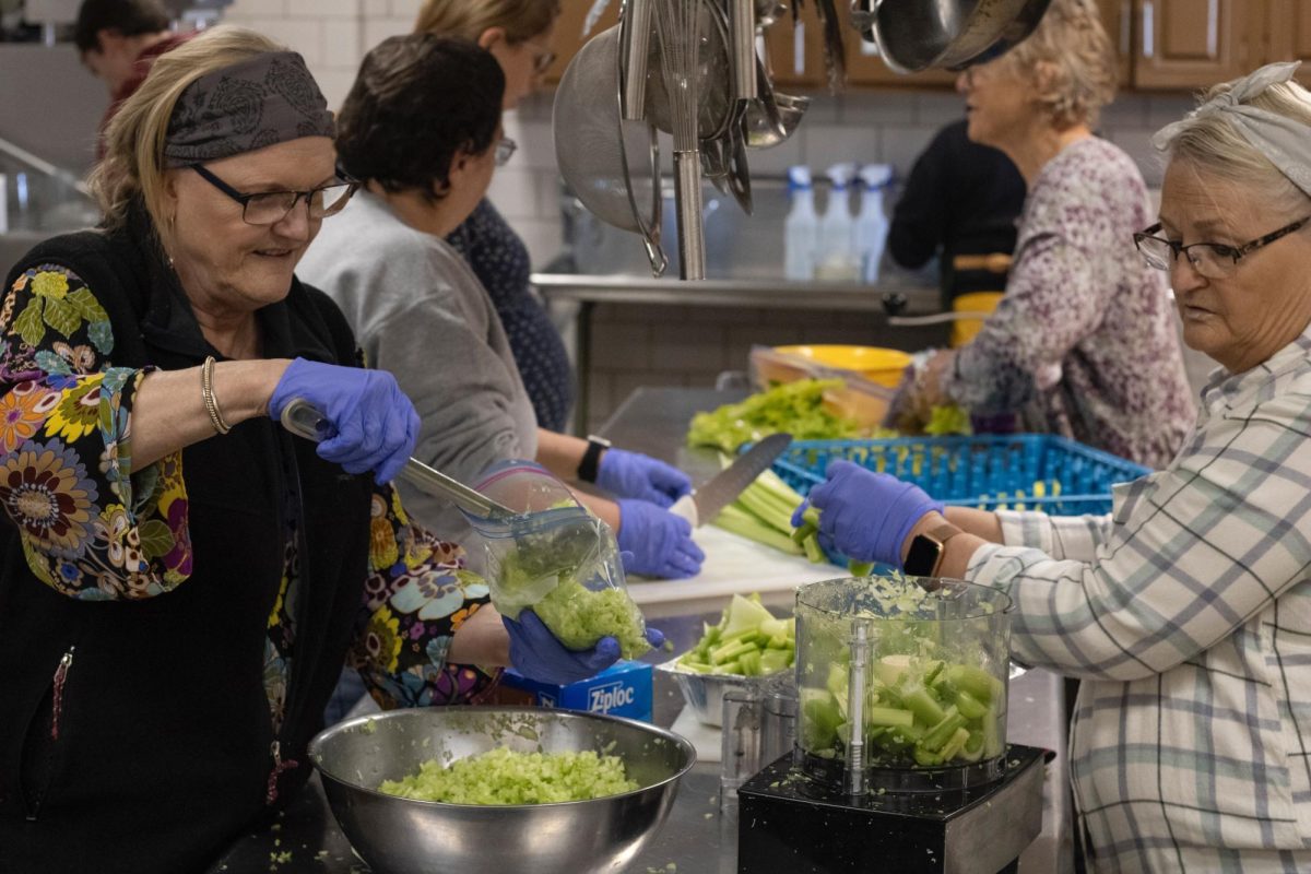 Karen Lesniak (left) and Pam Jerreell (right) prepare celery for stuffing Nov. 26, 2024 at the
Newman Catholic Student Center in Carbondale, Illinois. Lesniak has been volunteering at
this event for 10 years, and this year and the last she has driven for five and a half hours
from Chicago to volunteer. Jerrell has also been volunteering for 11 years and comes from
Anna.