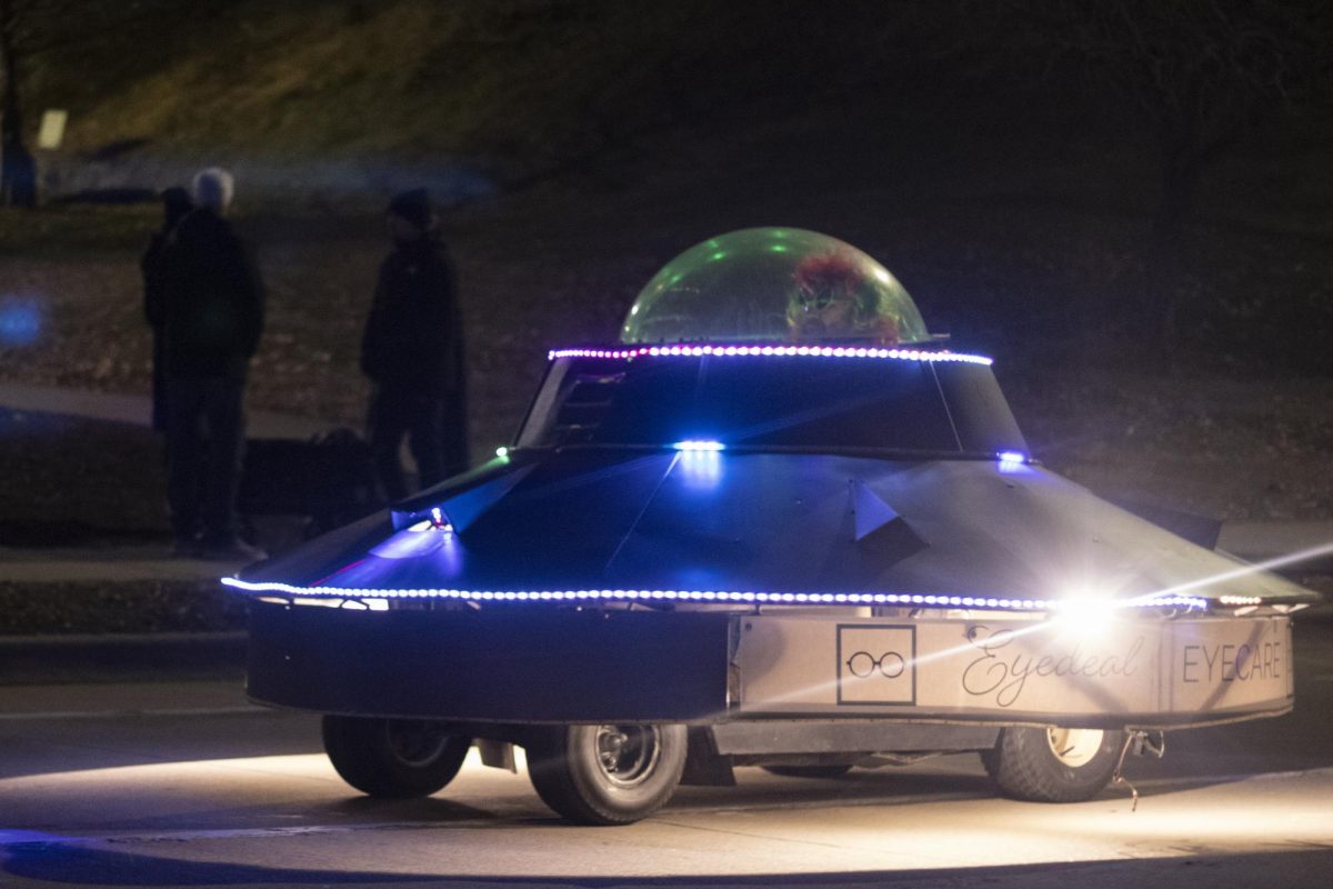 The Eyedeal Eyecare float drives down Mill street in the Lights Fantastic Parade Dec. 7, 2024 in Carbondale, Illinois. 