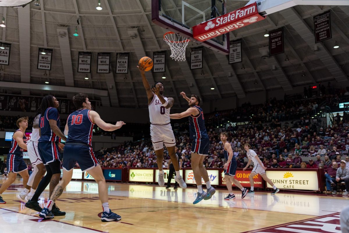 Rolyns Aligbe goes for a layup once getting past his defender Alex Horiuk in the Banterra Center December 7, 2024.