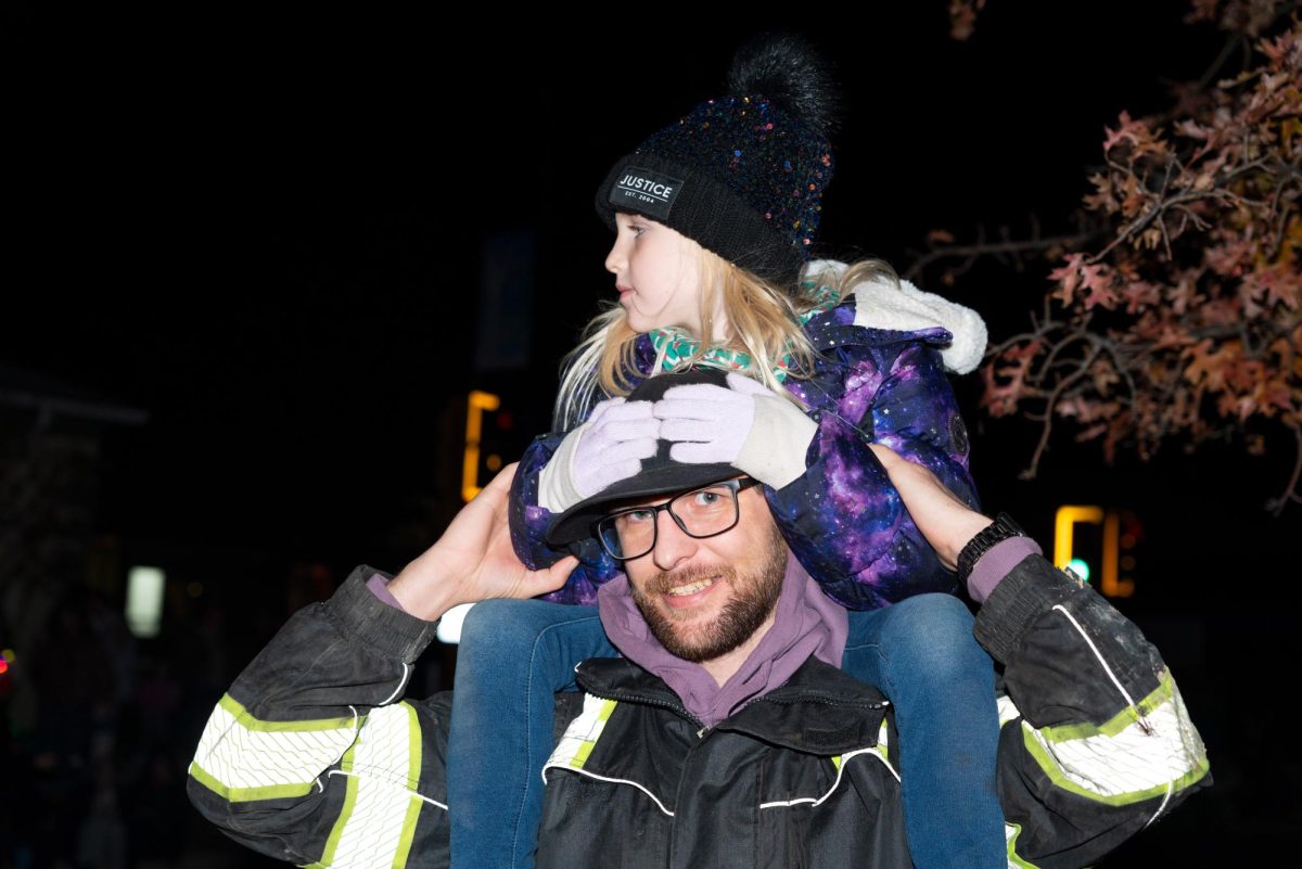 John Reid and his daughter Mia Reid come from Makanda, Illinois to watch the Lights Fantastic Parade Dec. 7, 2024 in Carbondale, Illinois. 