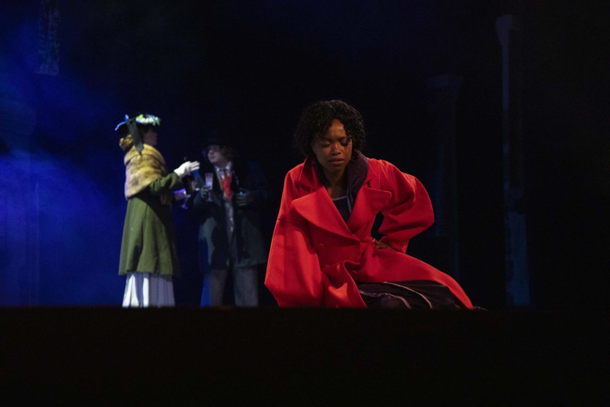 Martha Crachit (Makyla Mobley) sits down to rest after coming back from working her two jobs in the play Dec. 4, 2024 at McLeod Theater in Carbondale, Illinois.  “[The play] taking place in Cairo and us focusing on the class differences and race, it really does kind of bring to light… our forgotten history because we always talk about segregation, but we never really talk about how it affected people near us. We just get the generalized idea of ‘segregation is bad. We shouldn't do that anymore.’ But I like how this play is helping us focus on how it affects the family… I really just love how it's bringing to light to some parts of our history that sometimes we want to forget,” Mobley said. 