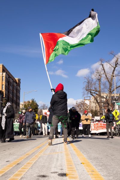 A protester holds a Palestinian flag in front of the We Fight Back protesters’ march Jan. 20, 2025 that went from the Meridian Hill Park down 16th Street to DuPont Circle Jan. 20, 2025 in Washington, D.C.