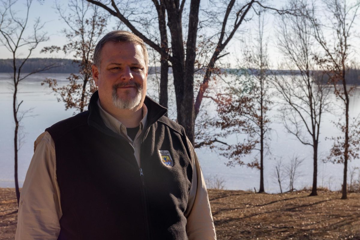 Justin Sexton, Refuge Manager of Crab Orchard National Wildlife Refuge and Cyprus Creek National Refuge, poses for a portrait in front of Crab Orchard Lake Jan. 24, 2025 at the Crab Orchard National Wildlife Refuge headquarters in Marion, IL.