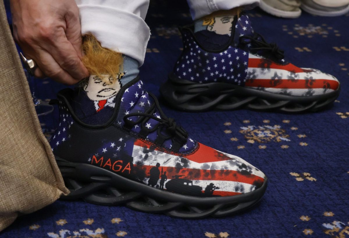 Richard Cox shows off his Trump-themed socks with orange hair at the Welcome Southern Illinois Reception Jan. 19, 2025 at the Cannon House in Washington, D.C.