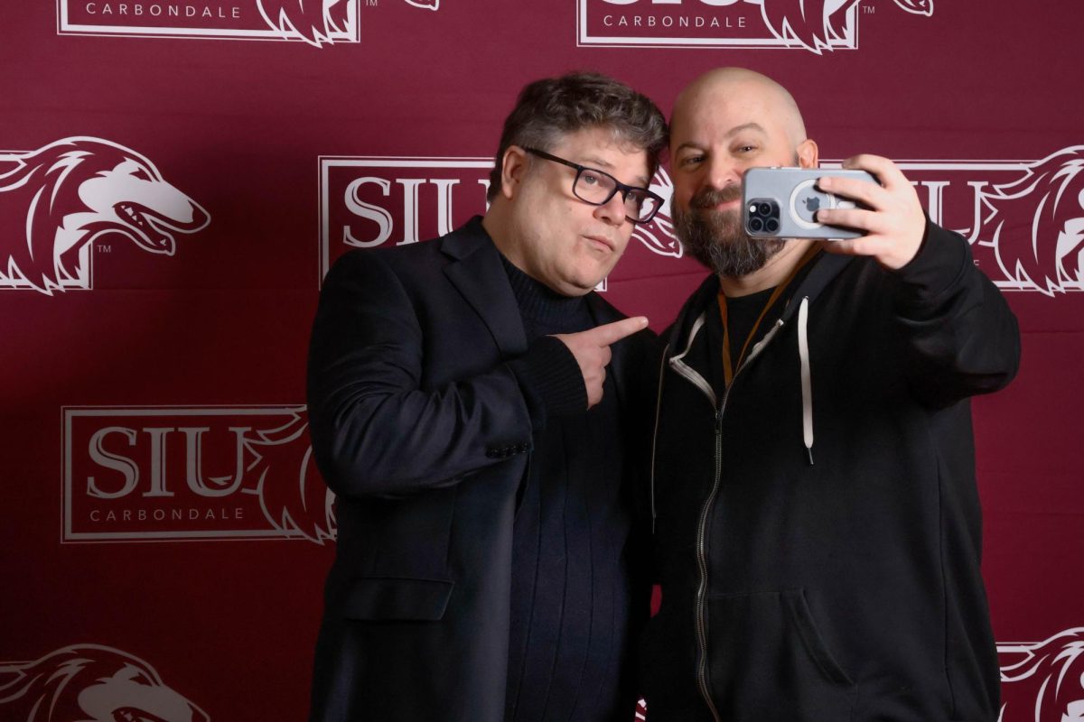 Sean Astin poses for a selfie with a fan during a meet and greet following the Saluki Con Special Speaker event Feb. 15, 2025 at Shryock Auditorium in Carbondale, Illinois.