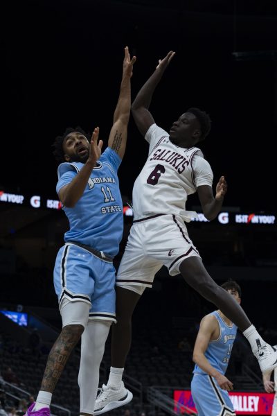 Ali Dibba (6) shoots the ball as he is guarded by Aaron Gray (11) of Indiana State March 6, 2025 at Enterprise Center in St. Louis, Missouri. The Dawgs beat the Sycamores by one in the final seconds with a final score of 86-85. 