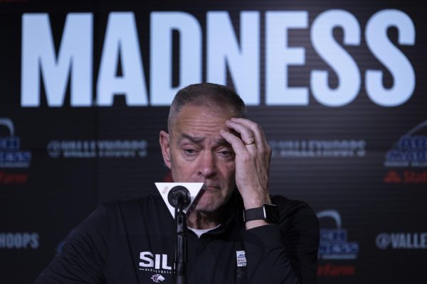 Head coach Scott Nagy listens to a question at the post-game interview following the Dawgs 70-52 loss to the Drake Bulldogs March 7, 2025 at Enterprise Center in St. Louis, Missouri. 