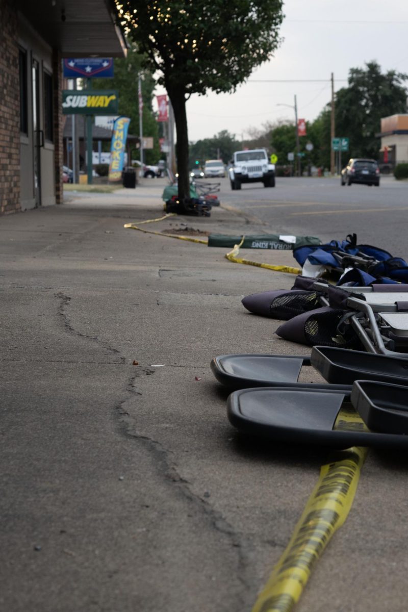 Folding chairs and lawn chairs claim spots on the sidewalk of Main Street Sept. 10, 2025 in Murphysboro, Illinois. The chairs have been placed to reserve spots for the scheduled parades for the Murphysboro Apple Festival. 