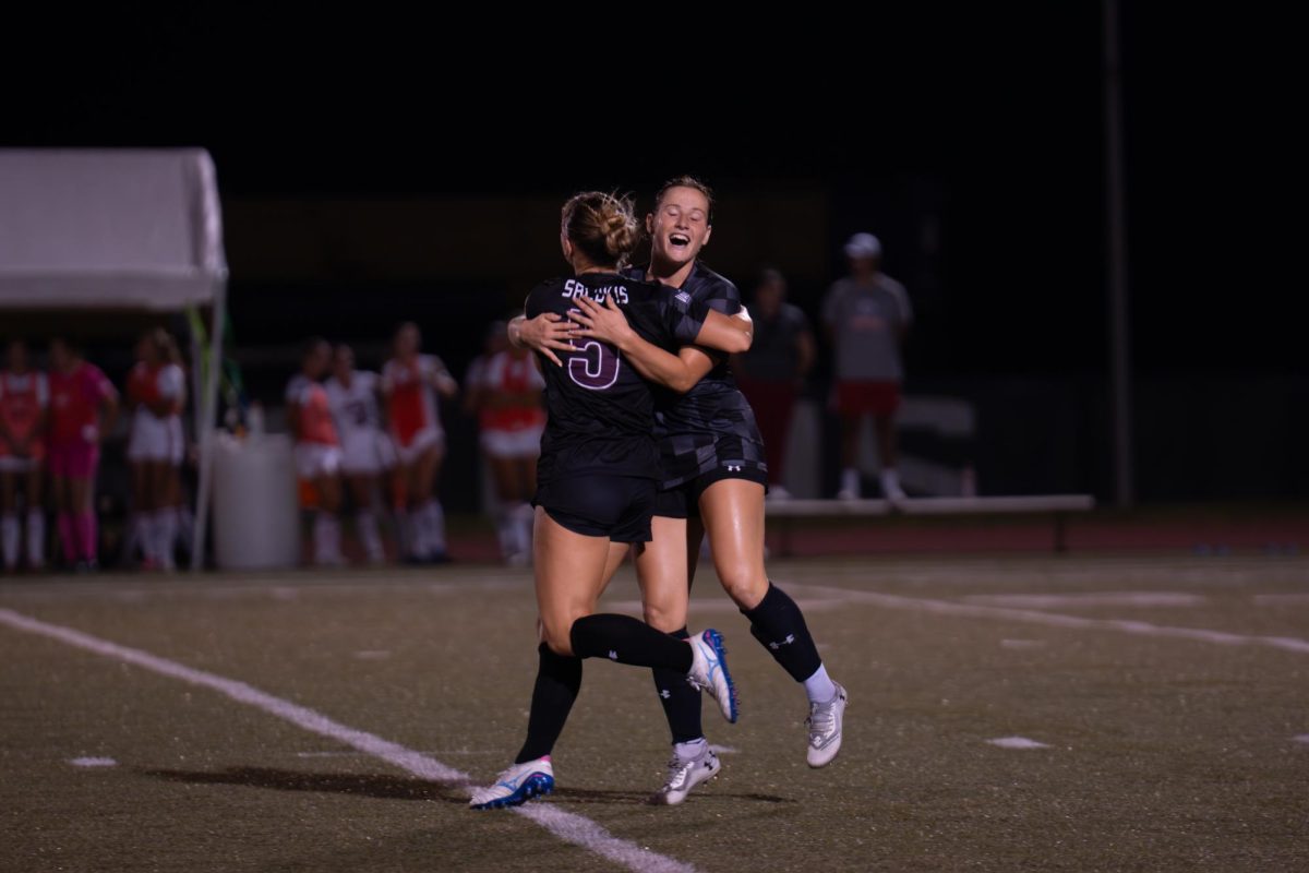 Saluki forward Sophia Schlicklin celebrates with teammate after kicking the game winning goal making the score 2-1 Sept. 19, 2025 at Lew Hartzog Track and Field Complex in Carbondale, Illinois. 
