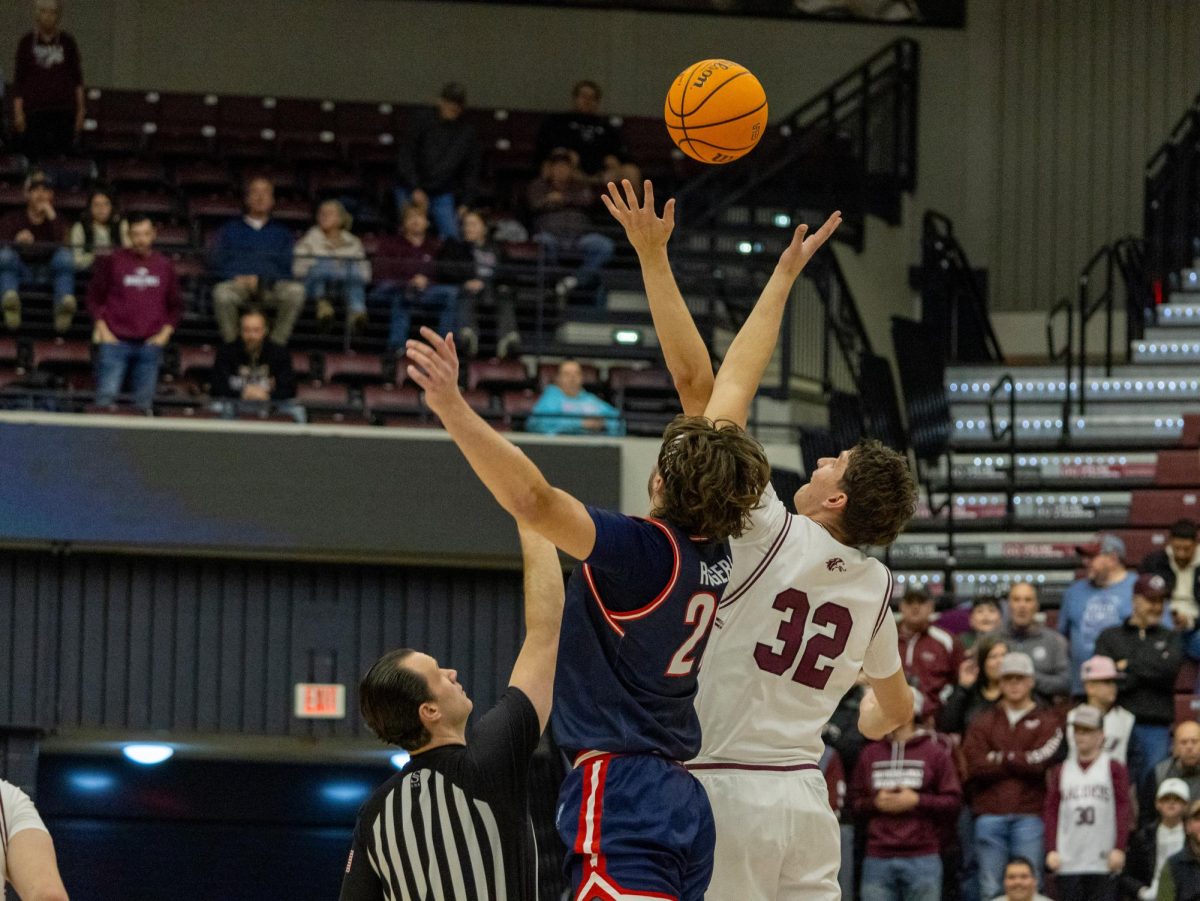 Jarrett Hensley (32) gave the Salukis the game start ball, Feb. 15, 2025 at Saluki Stadium in Carbondale, Illinois. 
