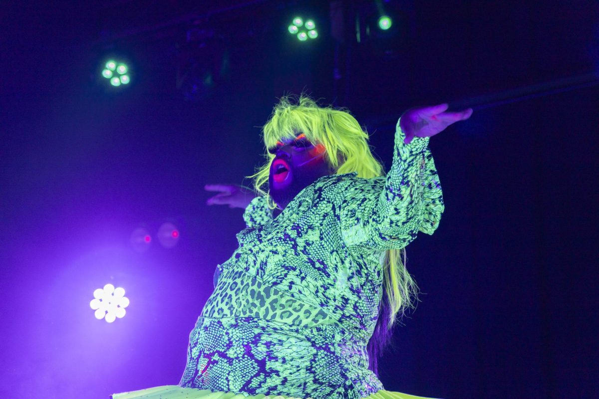 Naya Quetzal lifts her hands and arms up with the music Sept. 6, 2025 at Hangar 9 in Carbondale, Illinois. 