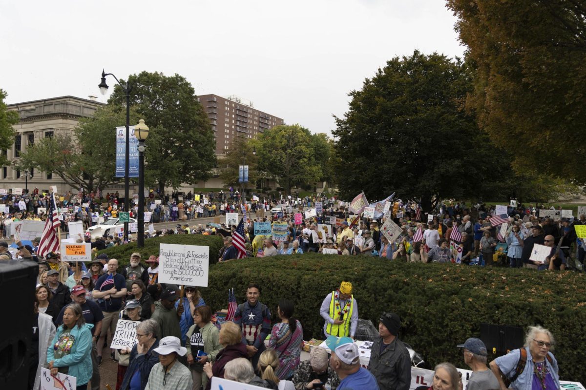 Protesters march down the streets near the Illinois State Capitol at the No Kings protest Oct. 18, 2025 in Springfield, Illinois.