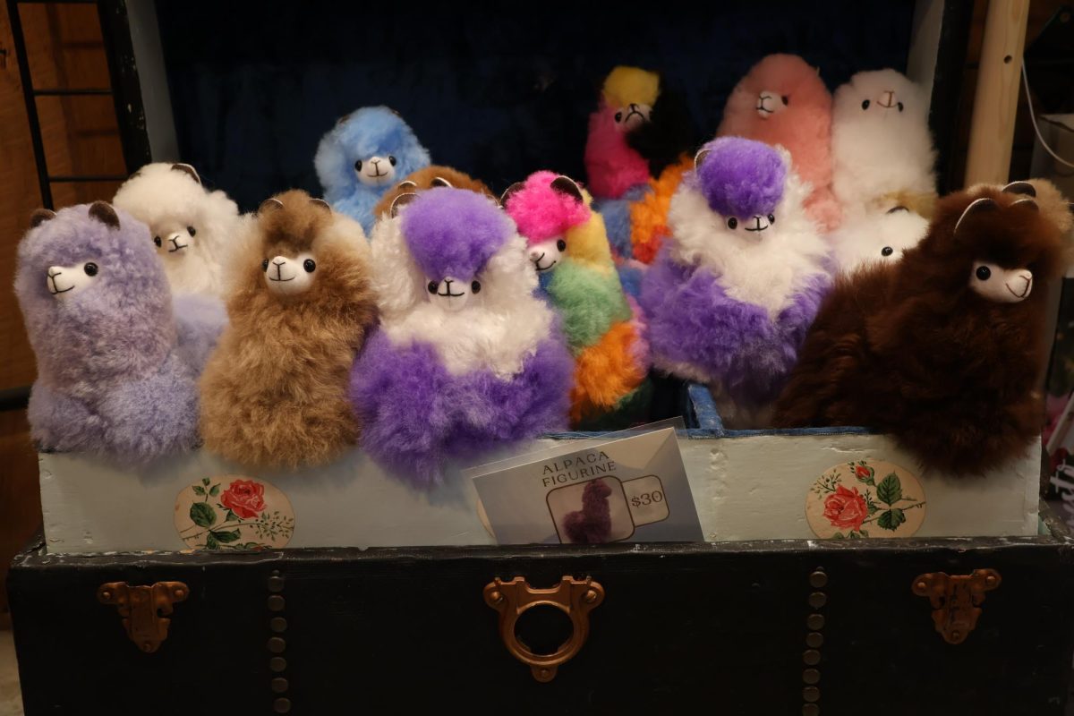 Alpaca figurine toys, made from fiber sourced on-site, sit arranged in the gift shop Nov. 14, 2025 at Rolling Oaks Alpaca Farm in Makanda, Illinois.