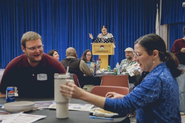 Dianah McGreehan, Director of Violence Protection Programs, continues to give out instructions while attendees begin discussion in the Civic Center Jan. 6, 2026. 