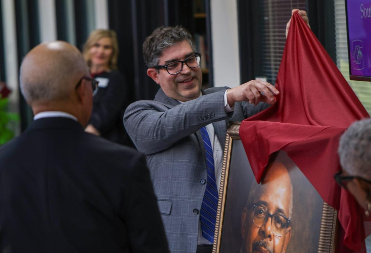 SIU honors alumnus Melvin Terrell with library collection, atrium