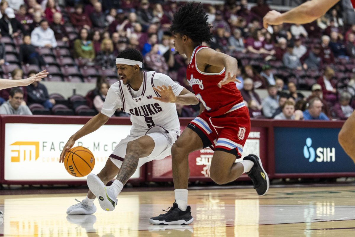 Jalen Haynes (5) dribbles the ball towards the basket as he is guarded by Bradley defense Feb. 15, 2026 at Banterra Center in Carbondale, Illinois.