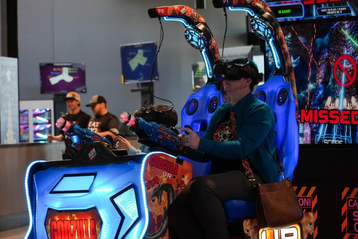 Rebekah Seabaugh and her daughter Mikayla Seabaugh play a Godzilla VR game during a sneak peak of Thrillhouse Jan 31, 2026 in Marion, Illinois.