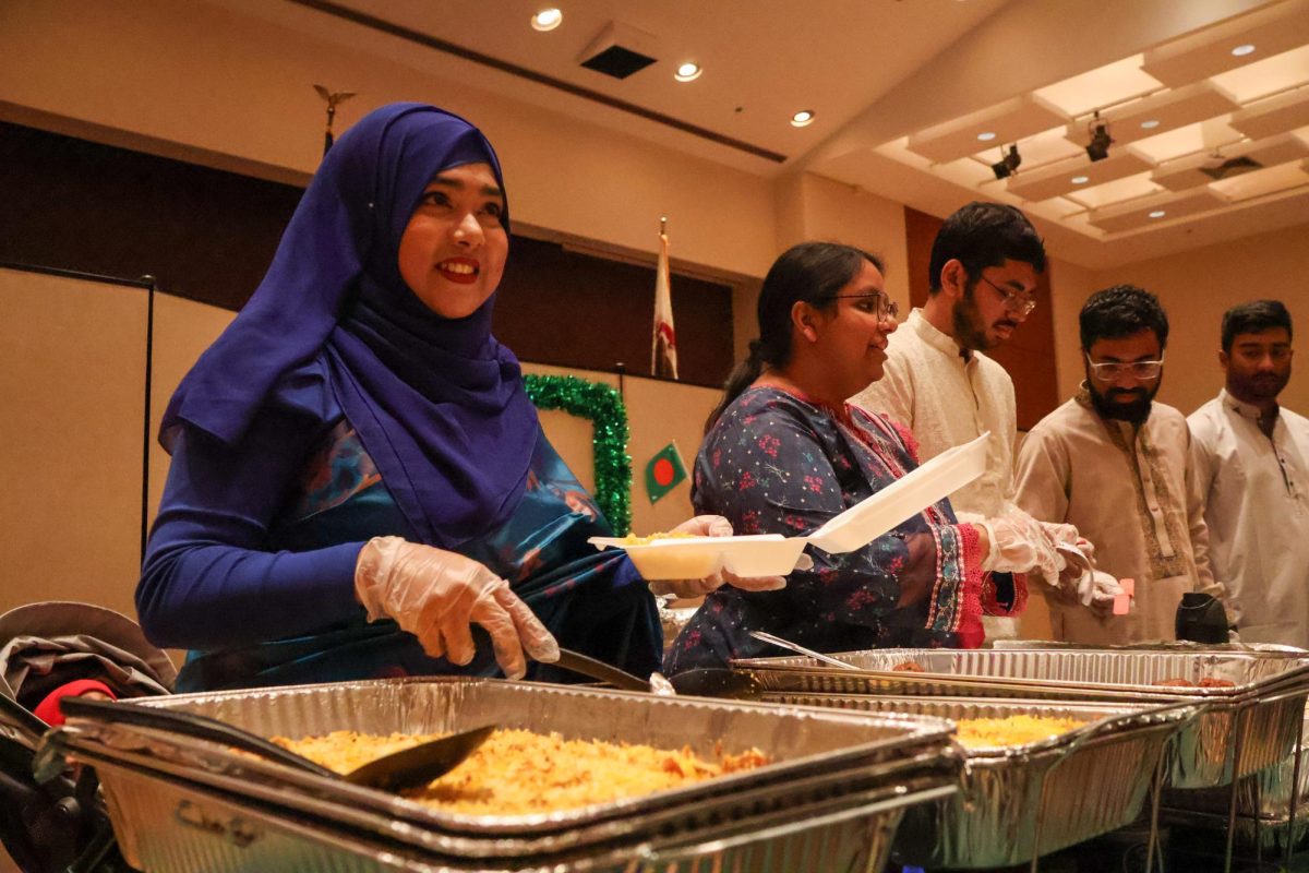 Members of the Bangladesh Student Association served traditional cuisine from their country at the International Food Fair Feb. 11 in SIU's Student Center ballrooms in Carbondale, Illinois. 