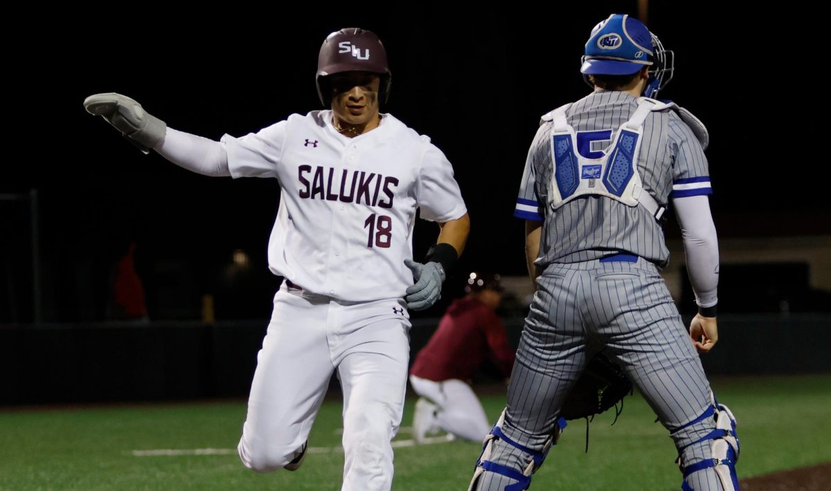 Jaden Flores (18) scores a run during the game against Seton Hall University Feb. 27, 2026 at Itchy Jones Stadium in Carbondale, Illinois.