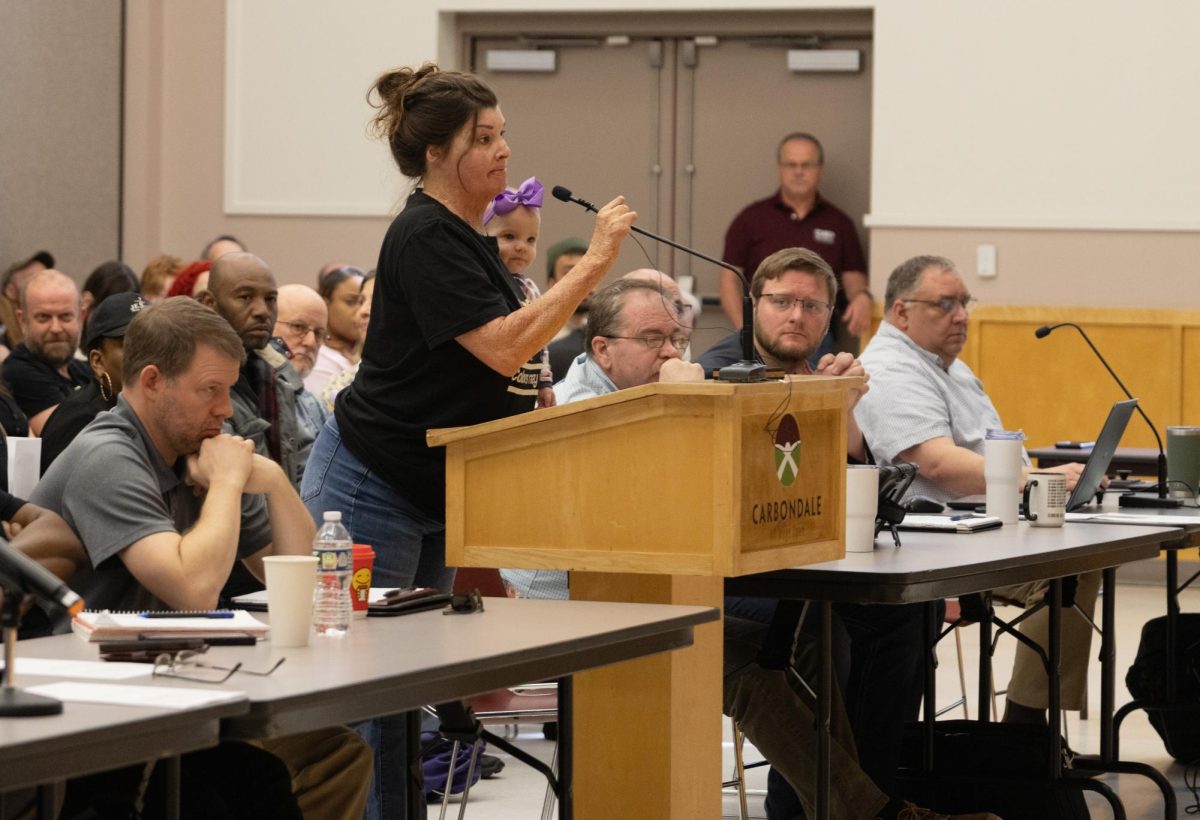 Tessa Leech speaks in front of Carbondale council members during a city hall meeting March 20, 2026 at the Carbondale Civic Center in Carbondale, Illinois. 