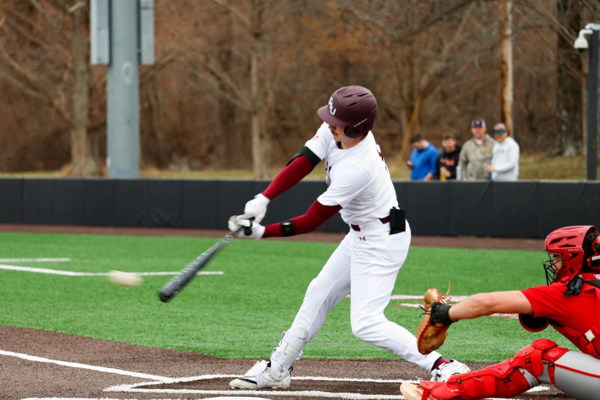 Kye Watson (9) hits the ball during SIU's game against the Miami RedHawks Feb. 25, 2026 at Itchy Jones Stadium in Carbondale, Illinois.