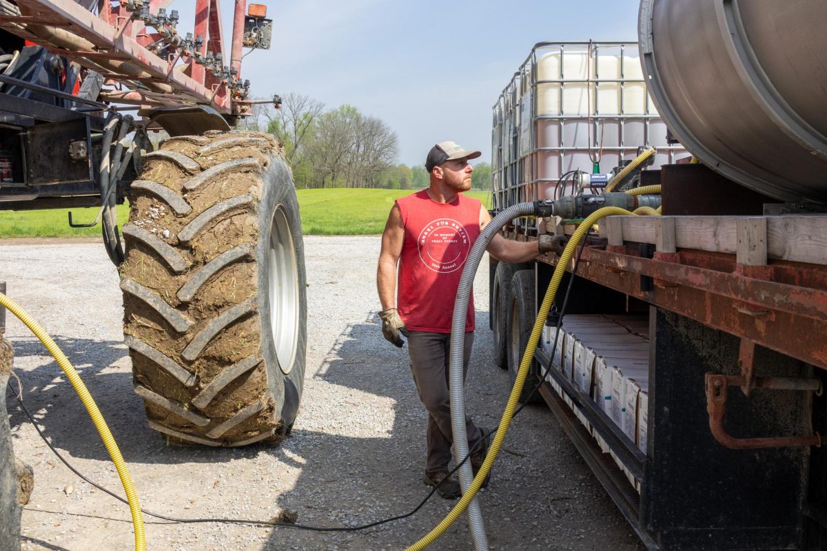 Gary Tretter watches the meter as he refills his truck April 11, 2026 to continue spraying the field with herbicides to get ready to plant at their farm in Murphysboro, Illinois.