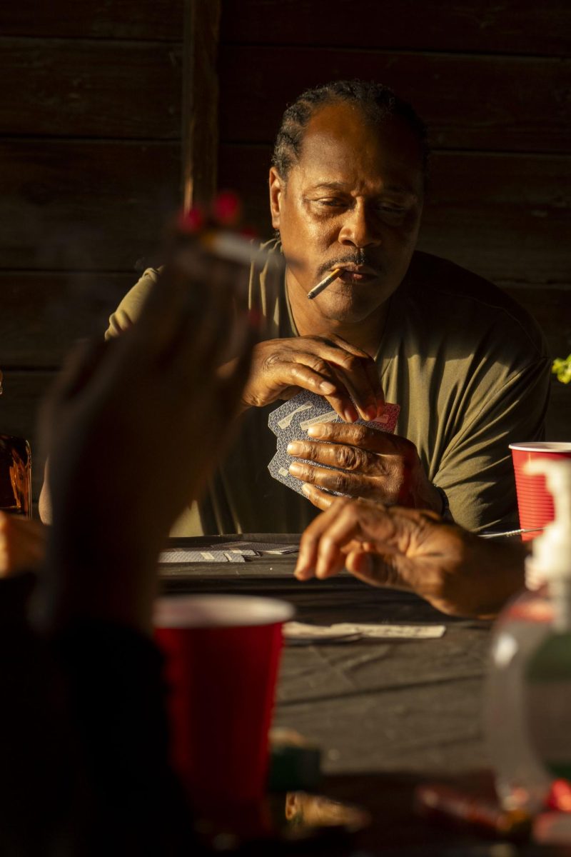 Juice plays card game spades with the adults at a birthday cookout April 11, 2026 in Murphysboro, Illinois.