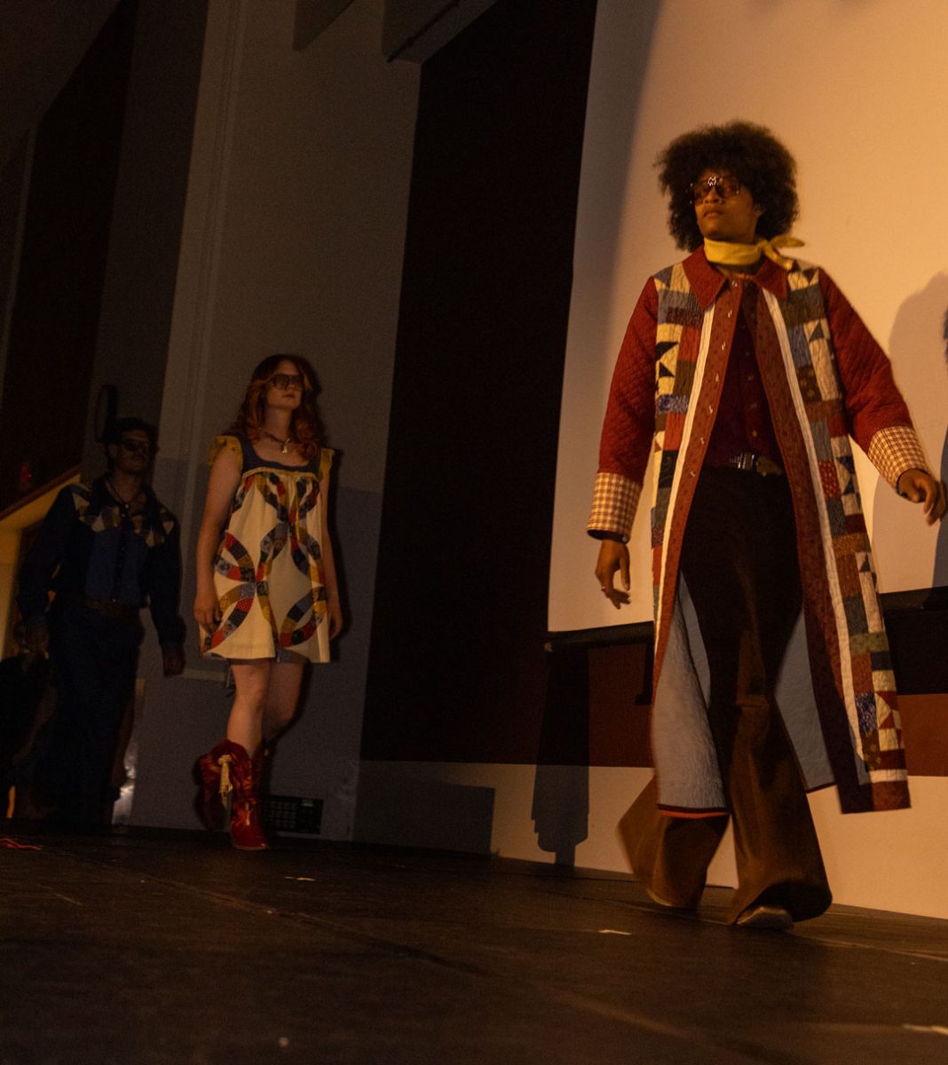 Models Derek Rios, Delia Franz and Zevin Woods enter the catwalk at the SIU fashion show April 23, 2026 in SIU's student center ballrooms in Carbondale, Illinois.