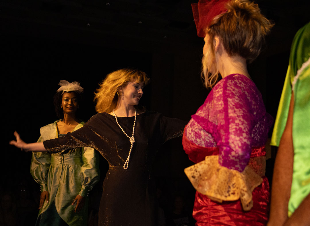 Designer Julia Dunlap exits the runway after receiving applause from the audience April 23, 2026 in SIU's Student Center ballrooms in Carbondale, Illinois.