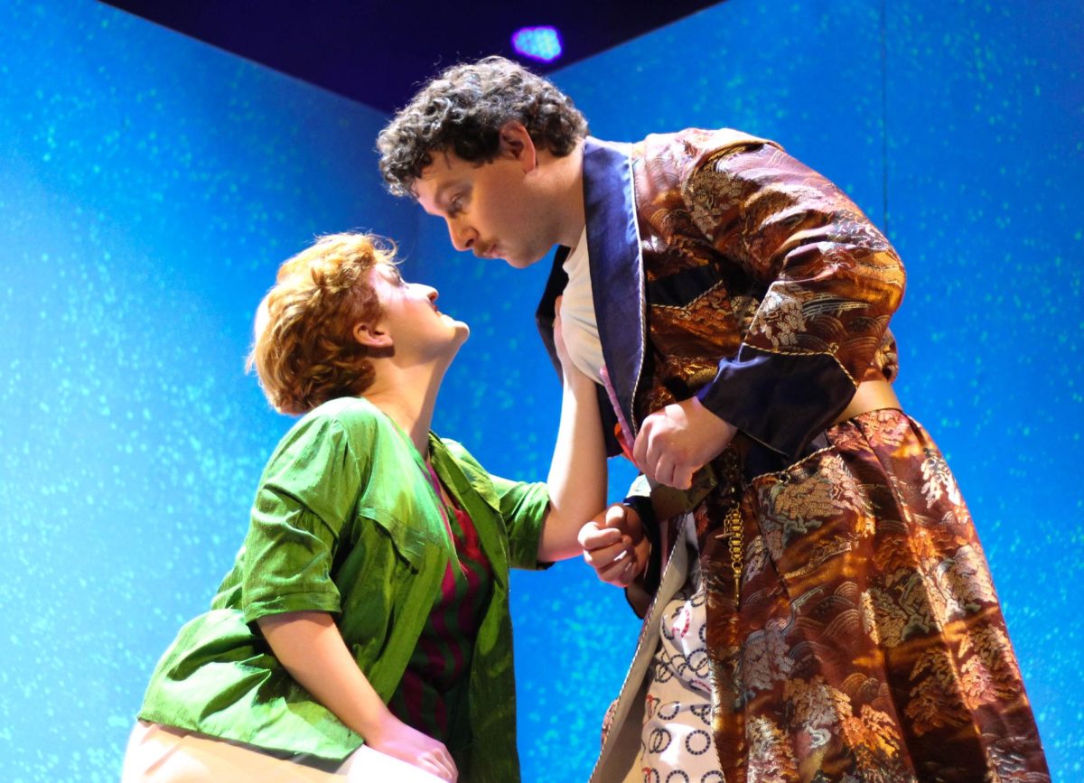 Reno Sweeney (Olivia Manning) attempts to woo Lord Evelyn Oakleigh (Harrison Gilbert) in hopes to ruin his engagement March 22, 2026 during a dress rehearsal of “Anything Goes” at the Shryrock Auditorium in Carbondale, Illinois.