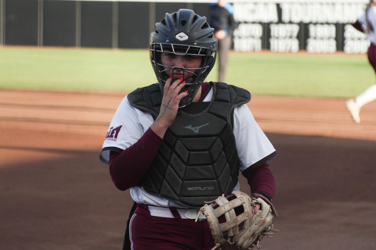 Catcher Sydney Potter adjusts her mask after a play against the SIUE Cougars April 29, 2026 at the Charlotte West Stadium in Carbondale, Illinois.