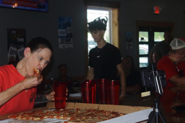 Molly Schuyler about halfway through the Pizza Villa 28-inch pizza challenge in Anna Illinois. July 17, 2026.