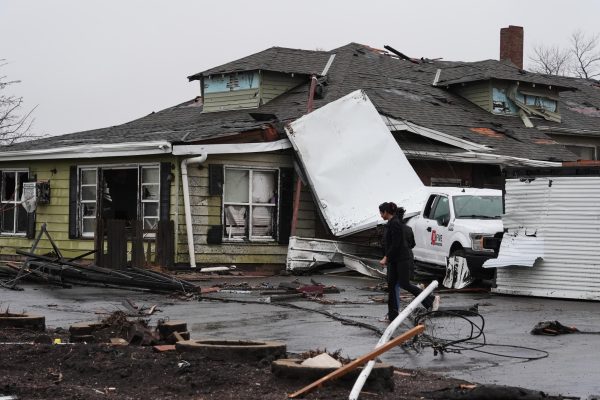 People look over damage in the aftermath of a powerful storm that ripped through the area a day earlier in Kankakee on Wednesday, March 11, 2026. (AP Photo/Nam Y. Huh)